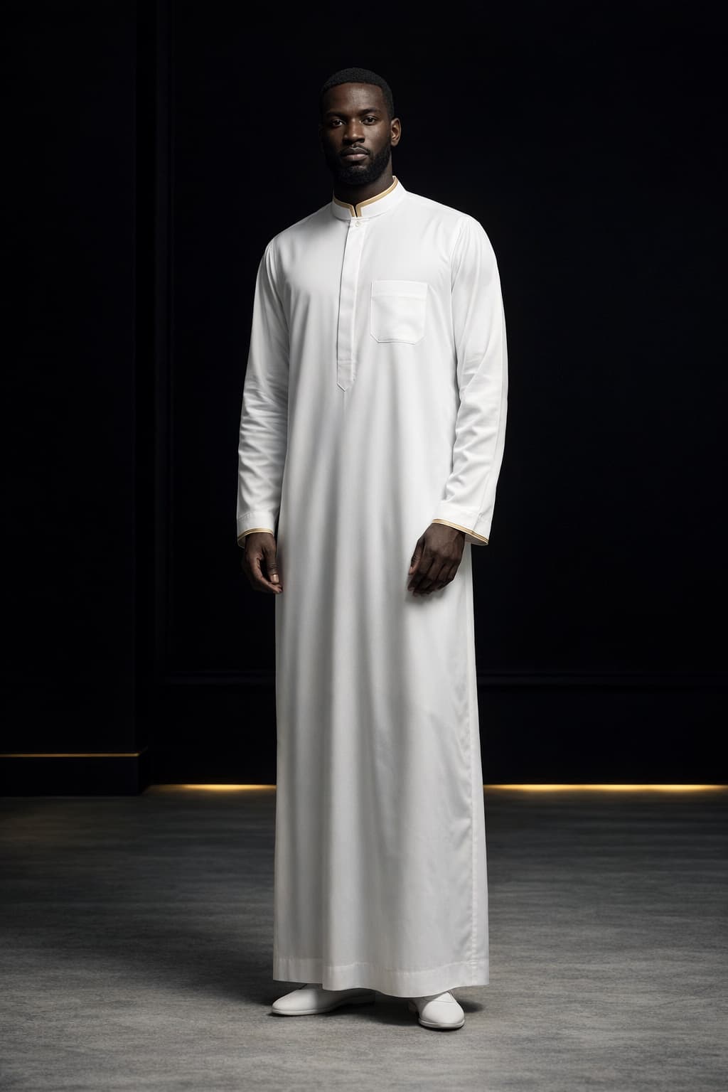 Black-skinned Muslim man in white premium Lebas thobe